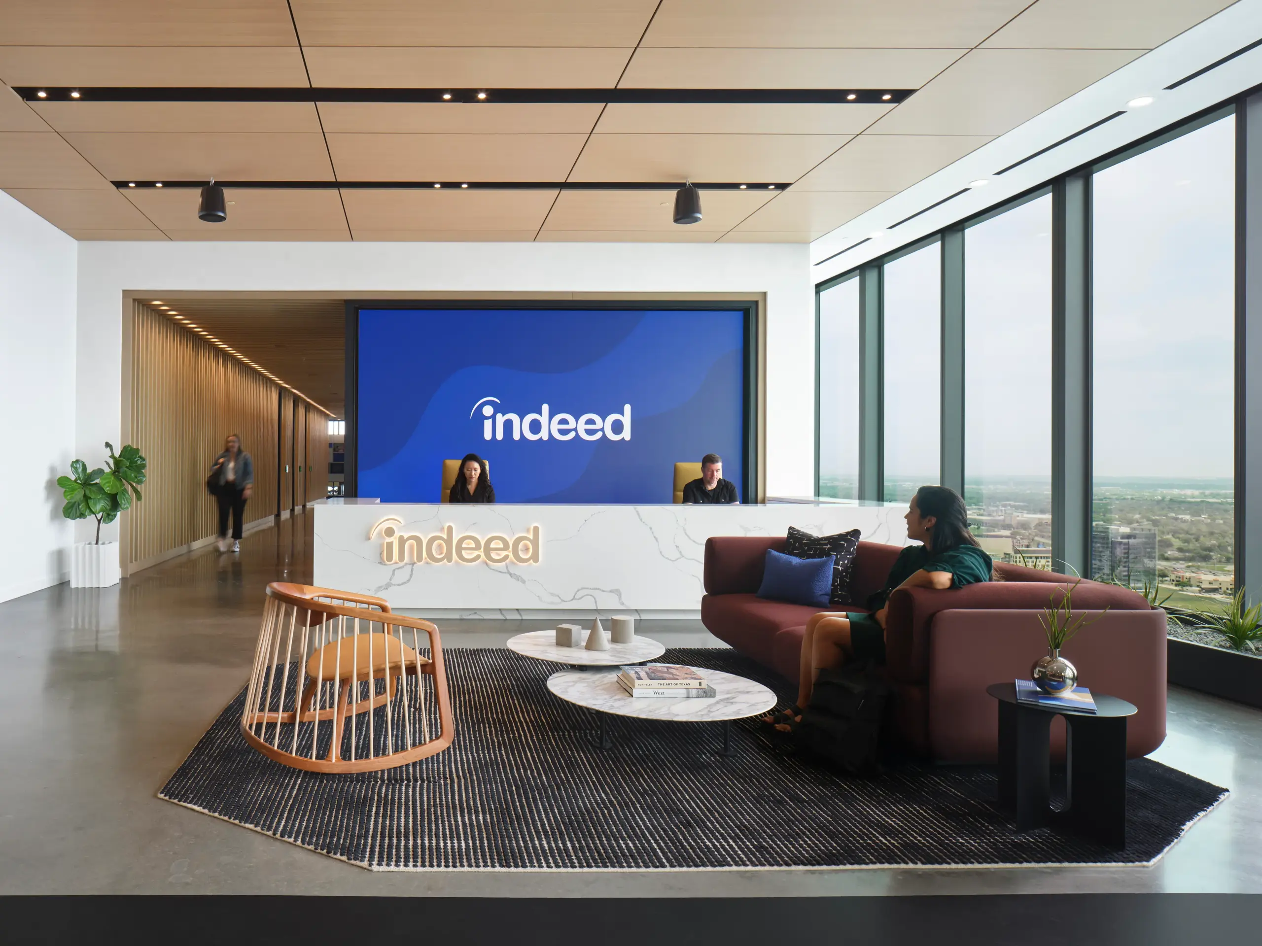 Indeed office lobby with the Indeed logo on screen