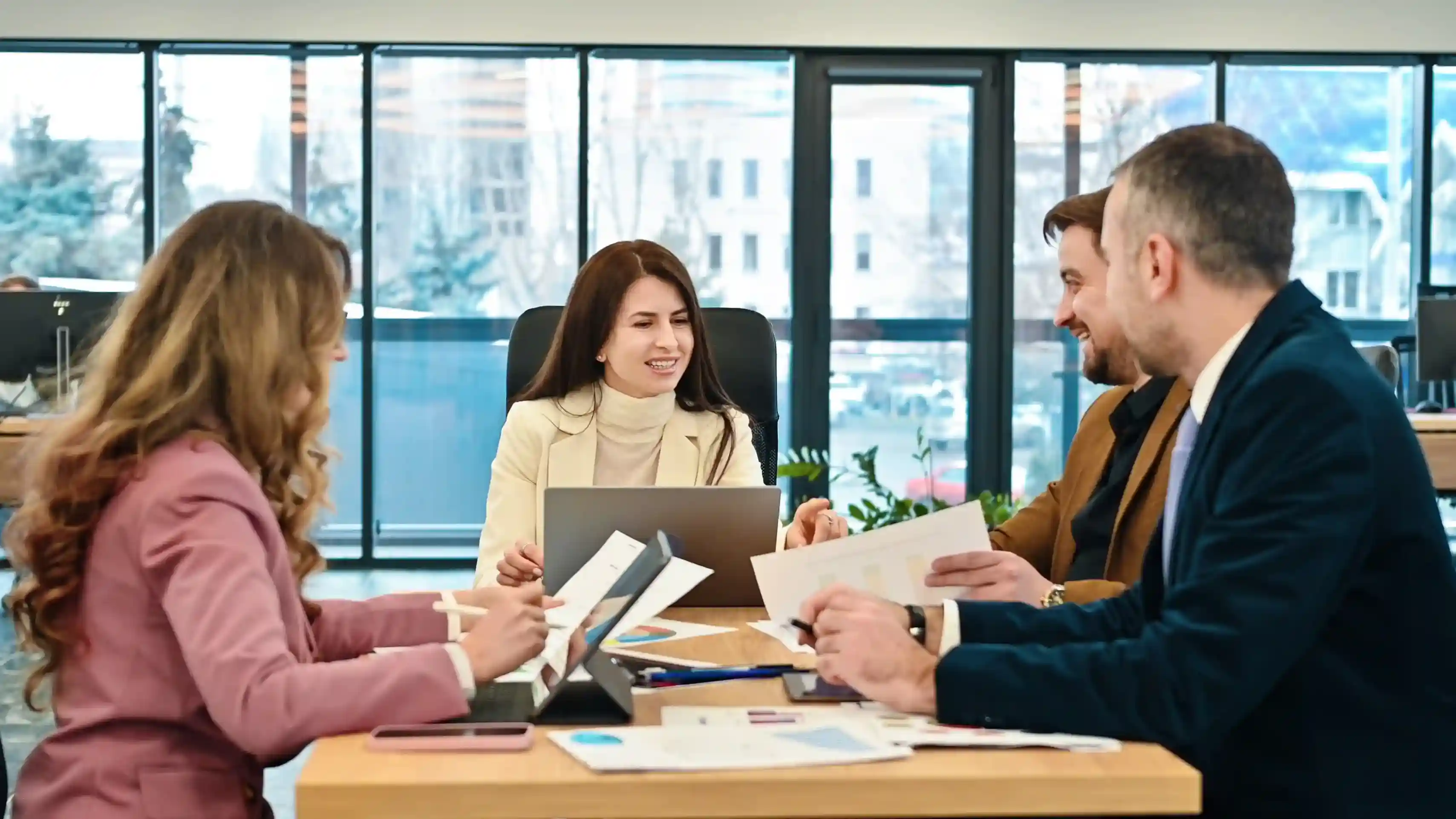 Business stakeholders reviewing creative requests together at a conference table